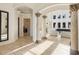 Elegant entry hall with marble columns, arched doorways and tile floors at 1513 Jones Rd, Roswell, GA 30075