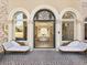 Elegant entryway with arched doorways and ornate columns at 1513 Jones Rd, Roswell, GA 30075