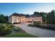 Stunning brick home with a grand entrance and beautifully landscaped grounds at 1513 Jones Rd, Roswell, GA 30075