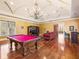 Spacious game room with pool table, seating area, and wet bar at 1513 Jones Rd, Roswell, GA 30075