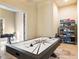 Game room with air hockey table, foosball table, and game storage at 1513 Jones Rd, Roswell, GA 30075