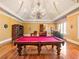 Spacious game room with hardwood floors and a pool table at 1513 Jones Rd, Roswell, GA 30075