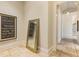 Elegant hallway with tile floors and a large mirror at 1513 Jones Rd, Roswell, GA 30075