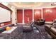 Spacious home theater with tiered seating and a large projection screen at 1513 Jones Rd, Roswell, GA 30075