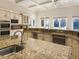 Modern kitchen with granite countertops and stainless steel appliances at 1513 Jones Rd, Roswell, GA 30075