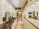 Basement kitchen with granite countertops and white cabinets at 1513 Jones Rd, Roswell, GA 30075