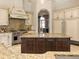 Elegant kitchen with custom cabinetry, granite counters, and a large island at 1513 Jones Rd, Roswell, GA 30075