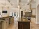Open kitchen with large island, custom cabinetry, and high-end appliances at 1513 Jones Rd, Roswell, GA 30075