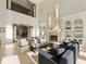 Sunlit living room features a fireplace, built-ins and high ceilings at 1513 Jones Rd, Roswell, GA 30075