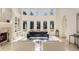 Living room with wall of windows, fireplace and high ceilings at 1513 Jones Rd, Roswell, GA 30075