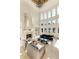 Living room with high ceilings, fireplace, and large windows at 1513 Jones Rd, Roswell, GA 30075