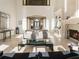 Bright living room with high ceilings, fireplace and access to a balcony at 1513 Jones Rd, Roswell, GA 30075