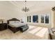 Bright main bedroom with ample natural light and sitting area at 1513 Jones Rd, Roswell, GA 30075