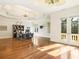 Home office with hardwood floors, built-in shelving, and large windows at 1513 Jones Rd, Roswell, GA 30075