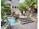 Resort-style pool and spa with stone waterfall and decking at 1513 Jones Rd, Roswell, GA 30075