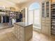 Spacious walk-in closet with custom built-ins and island at 1513 Jones Rd, Roswell, GA 30075