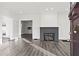 Bright living room featuring hardwood floors, fireplace and French doors at 2044 Fairhaven Cir, Atlanta, GA 30305