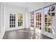 Sunroom with built-in shelving and multiple windows at 2044 Fairhaven Cir, Atlanta, GA 30305