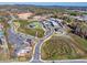 Aerial view of a town center with buildings and roads at 3390 Hillshire Dr, Cumming, GA 30028