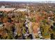 Aerial view of a residential neighborhood showcasing homes with autumn foliage at 921 Byron Sw Dr, Atlanta, GA 30310