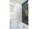 Stylish bathroom featuring a walk-in shower with black marble tile at 921 Byron Sw Dr, Atlanta, GA 30310