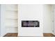 Modern electric fireplace with built in shelving at 921 Byron Sw Dr, Atlanta, GA 30310