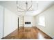 Living room with hardwood floors, fireplace, and built in shelves at 921 Byron Sw Dr, Atlanta, GA 30310