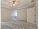 Primary bedroom with ceiling fan and built-in shelving at 5932 Rosie Se Ln, Mableton, GA 30126