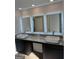 Double vanity bathroom with granite countertop and LED mirrors at 510 Overlook Rd, Covington, GA 30014