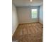 Spacious carpeted bedroom with large window at 510 Overlook Rd, Covington, GA 30014