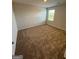 Spacious carpeted bedroom with window at 510 Overlook Rd, Covington, GA 30014