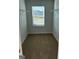 Well-lit bedroom closet with hanging rods at 510 Overlook Rd, Covington, GA 30014