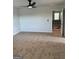 Spacious bedroom with ceiling fan and access to upper floor at 510 Overlook Rd, Covington, GA 30014