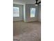 Bright bedroom with neutral walls, carpet, and ceiling fan at 510 Overlook Rd, Covington, GA 30014