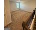 Spacious bonus room with carpeted floor and large window at 510 Overlook Rd, Covington, GA 30014