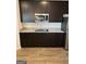 Modern kitchen with dark brown cabinets and granite countertops at 510 Overlook Rd, Covington, GA 30014