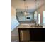 Kitchen island with granite countertop and stainless steel dishwasher at 510 Overlook Rd, Covington, GA 30014