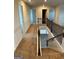 Upstairs hallway with carpet flooring and access to bedrooms at 510 Overlook Rd, Covington, GA 30014