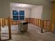 Dining room undergoing renovation with exposed walls at 1515 Alice Ave, Lithonia, GA 30058