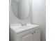 Small bathroom with vanity and round mirror at 2769 Da Vinci Blvd, Decatur, GA 30034