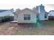 House back view with patio and fenced yard at 150 Lake Ter, Mcdonough, GA 30253
