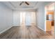 Bright bedroom featuring wood-look floors and access to bathroom and closet at 150 Lake Ter, Mcdonough, GA 30253