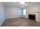 Living room with vaulted ceiling, fireplace and hardwood floors at 150 Lake Ter, Mcdonough, GA 30253