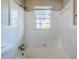 Clean bathroom with white tile and a shower/tub combo at 231 Glenrose Sw Cir, Atlanta, GA 30354