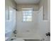Clean bathroom with white tile and a shower/tub combo at 231 Glenrose Sw Cir, Atlanta, GA 30354