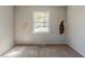 Bedroom with damaged wall and brown carpet at 231 Glenrose Sw Cir, Atlanta, GA 30354