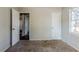Simple bedroom with brown carpet and neutral walls at 231 Glenrose Sw Cir, Atlanta, GA 30354