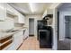 Efficient kitchen with white cabinets and appliances at 231 Glenrose Sw Cir, Atlanta, GA 30354