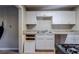 Simple kitchen featuring white cabinets and gas stove at 231 Glenrose Sw Cir, Atlanta, GA 30354