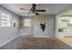 Living room with ceiling fan and damage to walls at 231 Glenrose Sw Cir, Atlanta, GA 30354